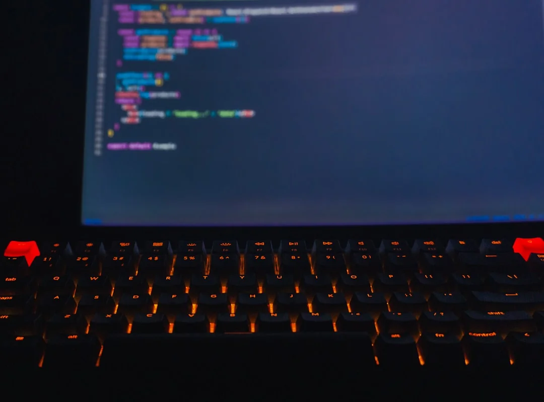 An adult uses a credit card for online shopping on a laptop indoors.